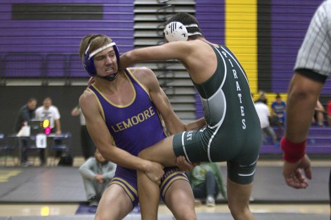 Lemoore's Kaj Davis tries for the upper hand in his match Saturday at the Lemoore Duals.